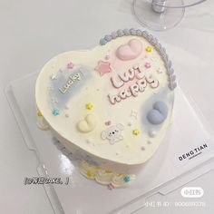 a heart shaped cake on top of a table