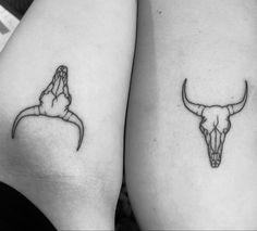 two tattoos on the legs of women with long horns