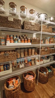 an organized pantry with baskets and food items