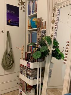 there is a book shelf with many books on it and a mirror in the corner