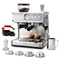 an espresso machine with four cups on the side and one coffee maker next to it