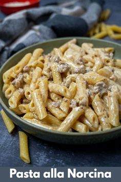 pasta alla noccina in a green bowl on a blue surface with the title above it