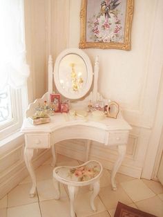 a white desk with a mirror on top of it