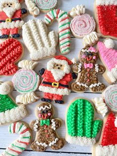 decorated cookies are arranged on a white table