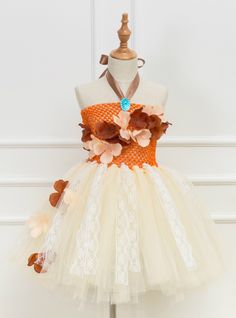 an orange and white dress with flowers on it