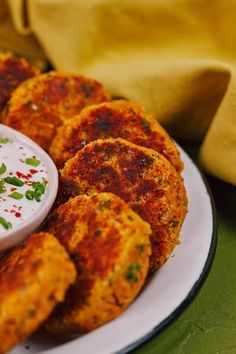 some food is sitting on a plate and ready to be eaten with sauce in the middle