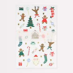 christmas stickers on white paper with trees, candy canes and gingerbreads