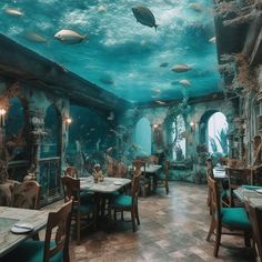 an underwater restaurant with fish swimming in the water and tables set up for people to eat