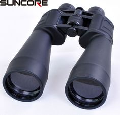 a pair of binoculars sitting on top of a white table next to the words suncorre