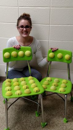 a woman sitting in front of a green chair with tennis balls on it and the words write a comment