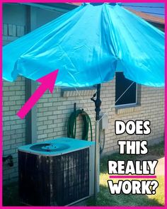 an umbrella is attached to the side of a building with a hot tub underneath it