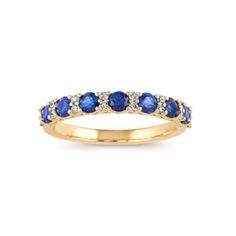 a yellow gold ring with blue sapphire and diamonds