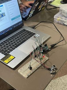 an open laptop computer sitting on top of a table