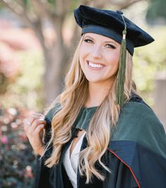 a woman wearing a graduation cap and gown