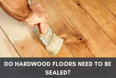 a person with a mop on top of a wooden floor that says do hardwood floors need to be sealed?