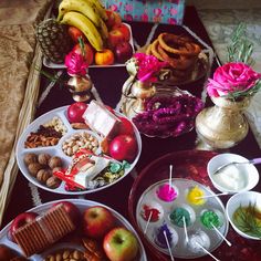 a table topped with lots of different types of foods and desserts next to each other