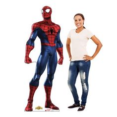 a woman standing next to a man in a spider - man costume on a white background