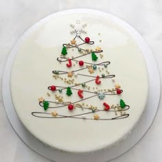 a white plate with a decorated christmas tree on it