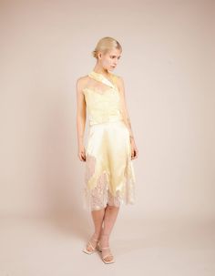 Pale yellow asymmetric silk skirt with metallic french lace Fastens with invisible zip at central backComposition: 100% Silk / Lace: 75% Lurex 25% NylonDry Clean OnlyFit and Model SizeModel wears UK size 6 and is 5'8'' (172 cm) Fits true to size, however those who are between sizes should take the larger size Light weight fabric, non stretch Designed to be fitted at waist, loose cut Silk Midi Skirt, Silk Tulle, Summer 22, Silk Lace, Silk Skirt, French Lace, Pale Yellow, Silk Top, High Low Dress