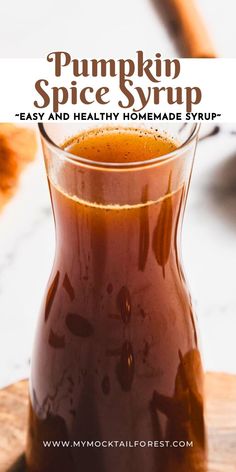 pumpkin spice syrup in a glass pitcher on top of a cutting board with text overlay