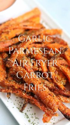 garlic parmesan air fryer carrot fries on a white plate with the words garlic parmesan air fryer carrot fries