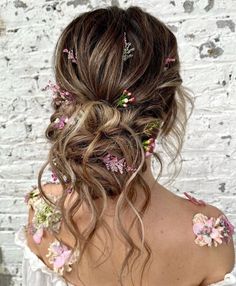 Wavy Bun with Flowers Fairy Princess Wedding Hair, Floral Updo Hairstyles, Enchanted Garden Hairstyle, Fairytale Updo, Messy Bun With Flowers, Boho Wedding Hair Updo, Wedding Hairstyles Boho, Bohemian Updo Hairstyles