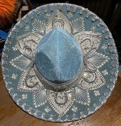 Beautiful SkyBlue Salazar Yepez Mariachi hat. Blue with silver embroidery, sequins good-luck double horseshoe on either end. Silver Wide Brim Adjustable Costume Hat, Silver Wide Brim Costume Hat With Adjustable Fit, Silver Adjustable Wide Brim Costume Hat, Western Silver Hat With Short Brim, Silver Brimmed Hat For Rodeo, Silver Curved Brim Hat For Rodeo, Silver Hat With Curved Brim For Rodeo, Mariachi Hat, Quince Stuff