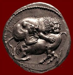 an ancient coin with two lions on it