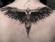 the back of a man's shoulder with a cross and wings tattoo on it