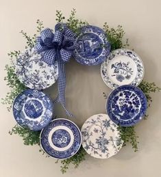 a wreath with blue and white plates on it