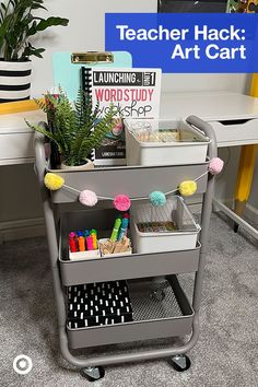 a cart with books and craft supplies on it in front of a computer desk that says teacher hack art cart