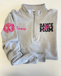 two sweatshirts with the word dance mom on them, one in pink and one in grey