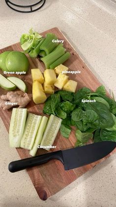 a cutting board topped with lots of different types of vegetables