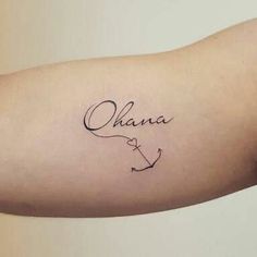 a person with a tattoo on their arm that says, ohana and an anchor