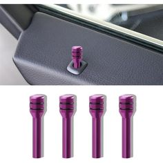 four purple knobs in the center console of a car, and an image of steering wheel