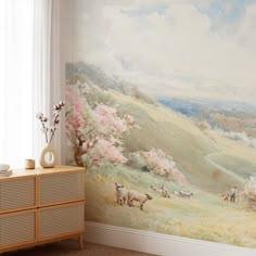 a room with a painting on the wall next to a dresser