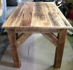 a wooden table sitting on top of a floor