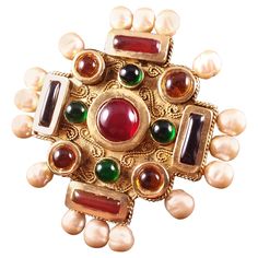 Rare, enormous Maison Gripoix for Chanel Byzantine Cruciform cuff bracelet. The symmetrical squared oversized cruciform cuff is composed of ruby, emerald, amythest and citrine poured glass pate de verre enamel cabochons which decorate the central motif. Hand made faux baroque pearls decorate this iconic byzantine Chanel cuff bracelet. Victoire de Castellane for Chanel. Excellent Condition, Signed Chanel. Likely a runway piece because of scale. Motif 4" x 4". Cuff is slightly malleable. Chanel Cuff Bracelet, Chanel Cuff, Chanel Shopping, Victoire De Castellane, Chanel Brooch, Maltese Cross, Ruby Emerald, Vintage Couture, Royal Jewels