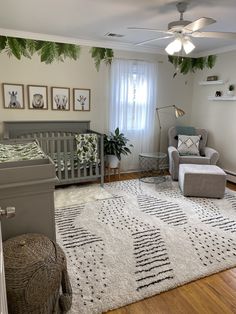 a baby's room with a crib, rocking chair, and nursery furniture