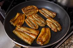 some food is cooking in a pan on the stove