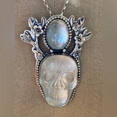 For All Those Skull Lovers This Is The One. Beautiful Huge Crystal Carved Skull That Measures 1 1/2” Long X 1” Wide. With A Beautiful Clear Blue Topaz That Measures 3/4” X 1/2”. All Set In Sterling Silver Antlers And Flowers. Maker Is Tranquil Designs. Chain Measures 16.5” Pendant Is 2 1/2”L X 1 3/4”W At Its Widest Point. This Is A Beautiful Statement Piece. Nwot Has Never Been Worn. Price Is Firm. Antlers And Flowers, Huge Crystal, Carved Skull, Skull Lover, Semi Precious Jewelry, Sterling Necklaces, Skull Carving, Gemstone Pendant, Blue Topaz