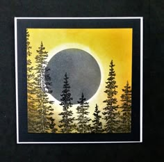 an image of a full moon with trees in the foreground and yellow sky behind it