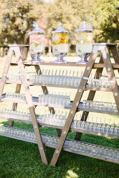 an outdoor bar cart with drinks on it