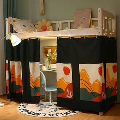 there is a bunk bed with curtains on the top and below it, next to a desk