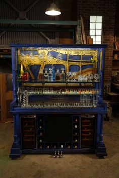 an old fashioned machine with many items on it's display case in a warehouse