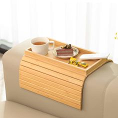 a tray with some food on top of it next to a coffee cup and spoon