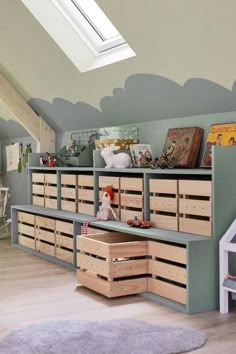 a child's playroom with toy cars, toys and books on the shelves