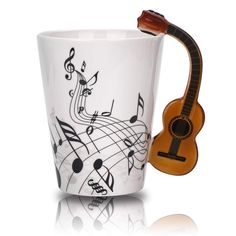 PRICES MAY VARY. Music Coffee Mug Perfect Gift: This well made super trendy guitar mug will be a perfect music gift for guitar players, guitarists, guitar enthusiasts, music lovers, musicians, music teachers gift High Quality handmade well,Holds hot beverage,enjoy coffee ,milk,tea,home,kitchen,school,office use Easy-grip with handle, suitable for hot and cold drinks,The music gifts for men hold a generous capacity of 12.9 Oz of both hot and cold beverages such as coffee, Milk,hot tea, hot,Size - Coffee Music, Guitar Gifts, Music Teacher Gifts, Drink Tea, Enjoy Coffee, Musician Gifts, Unique Vases, Musical Notes, Notes Design