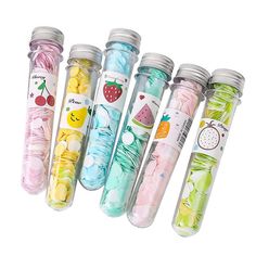 six different colored candy in glass bottles with the words sent at random 1 pcss