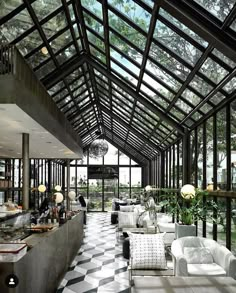 the inside of a restaurant with black and white checkered flooring